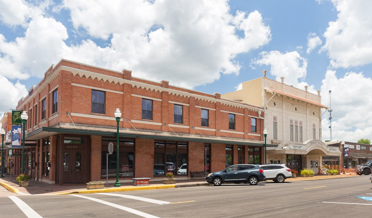 Historic storefronts along a street in downtown Conroe