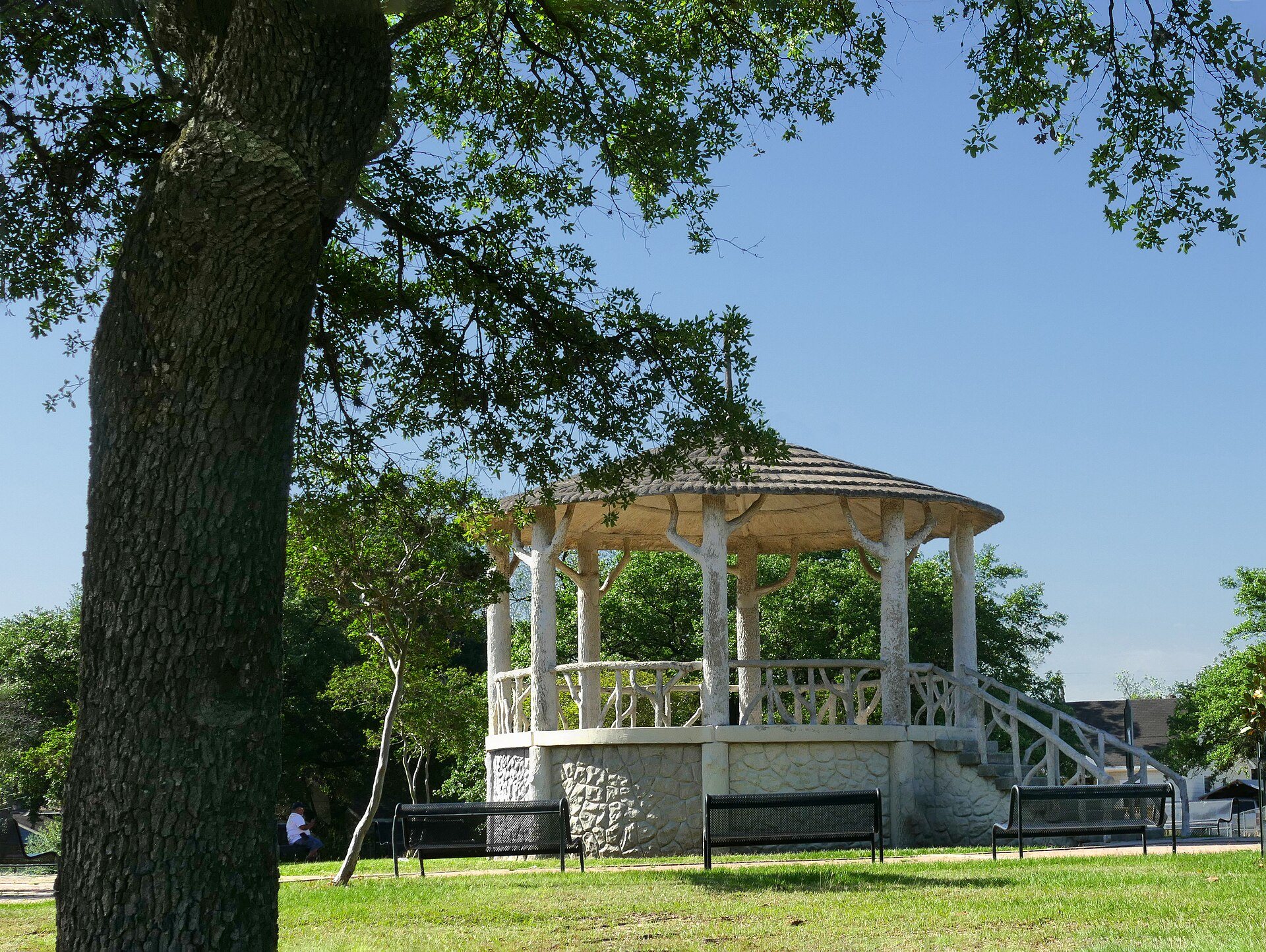 Historic gazebo beneath trees in Hidalgo Park, Magnolia Park