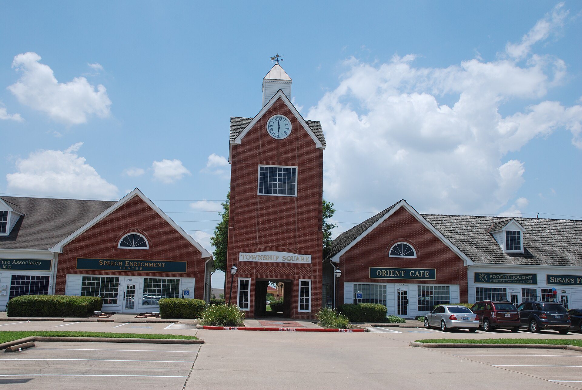 Clock tower and storefronts at Township Square in Missouri City