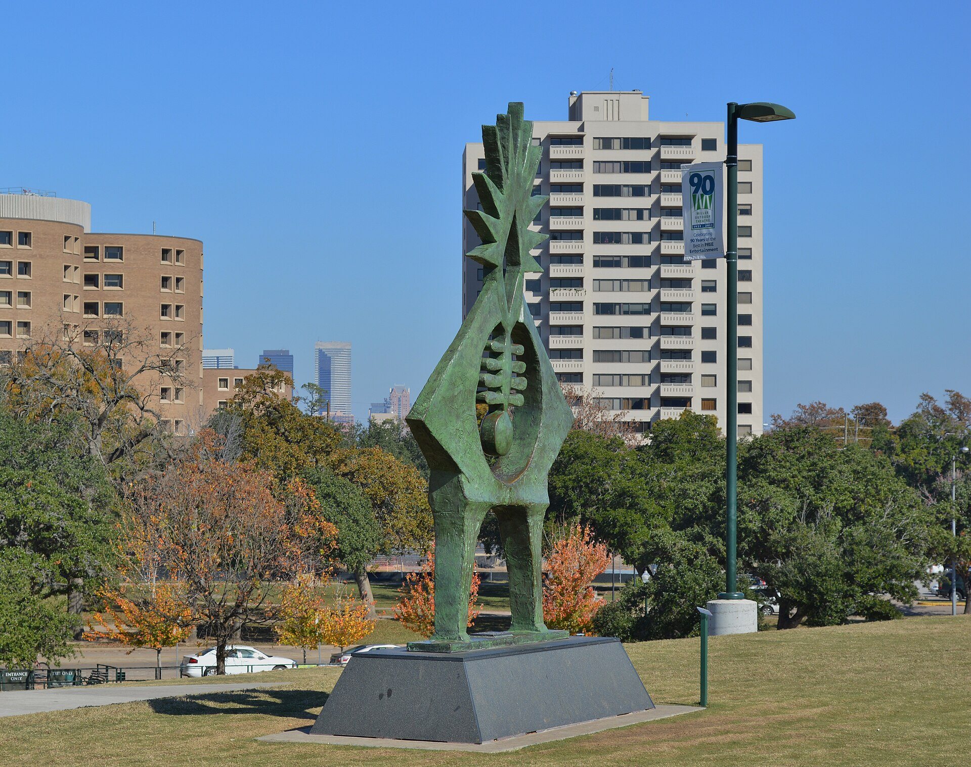 Hermann Park sculpture with Museum District towers behind it