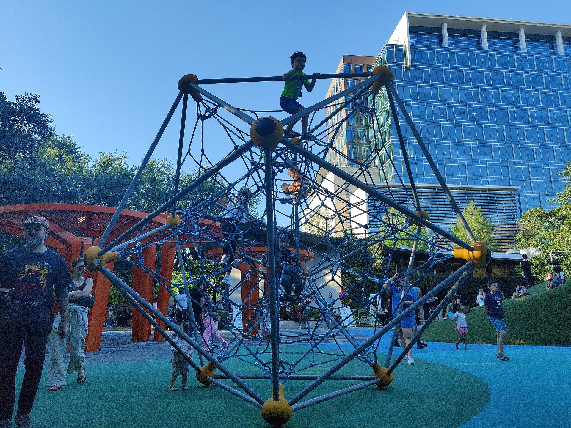 Climbing structure and trees at Levy Park in Upper Kirby