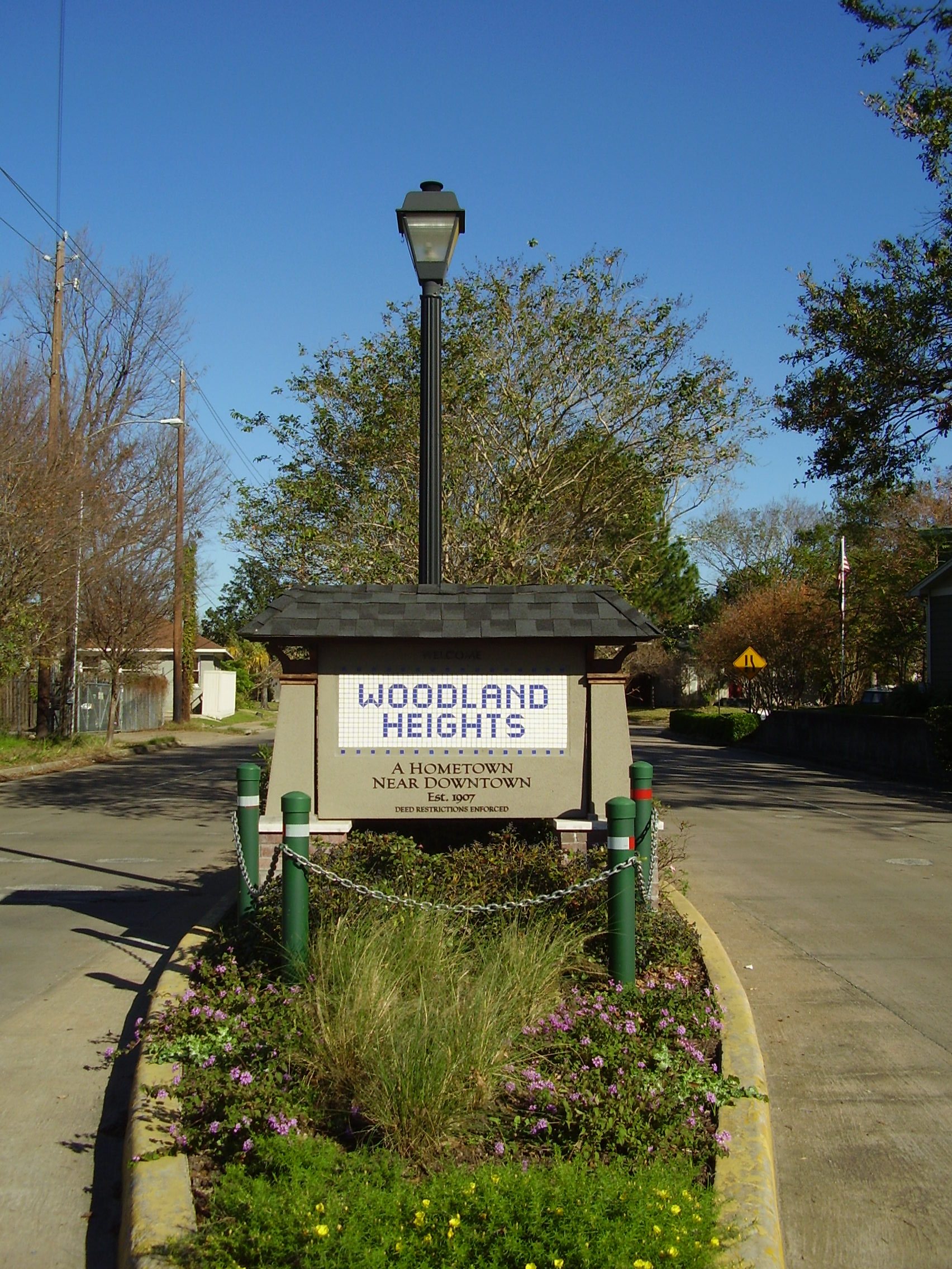 Woodland Heights neighborhood entrance with tree-lined streets